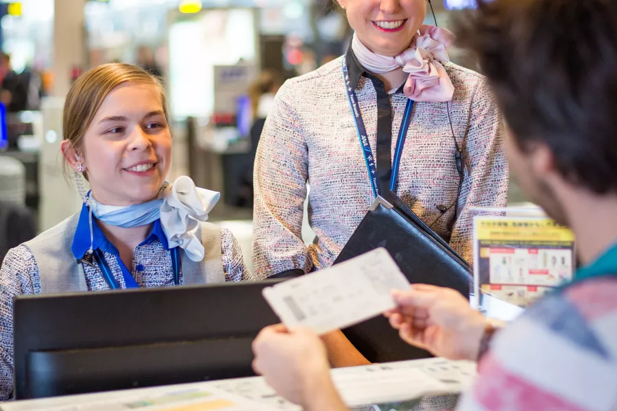girls working at the checkin desk